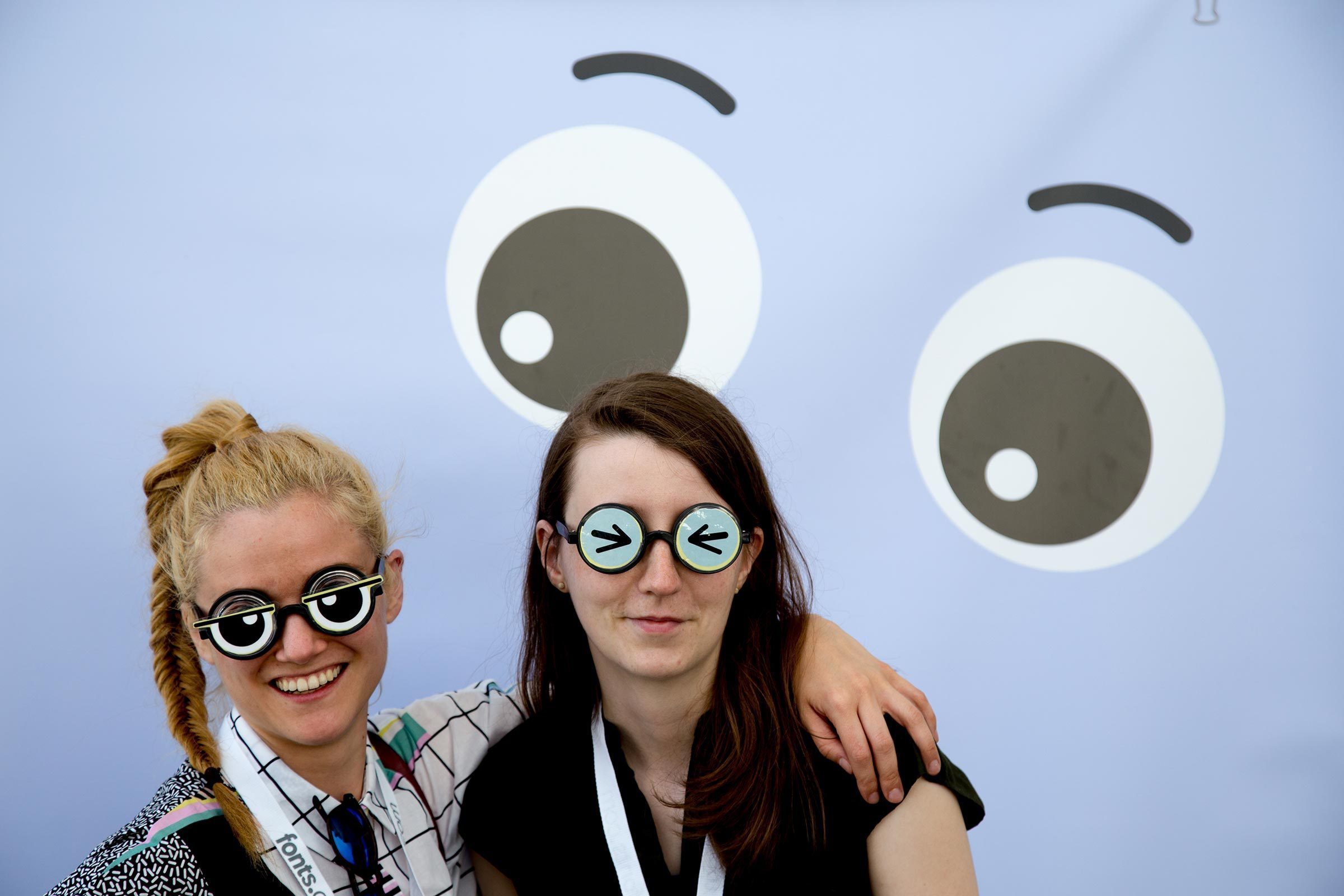 Ana and Jana from the Berlin office sample the goofy eyeglass table.