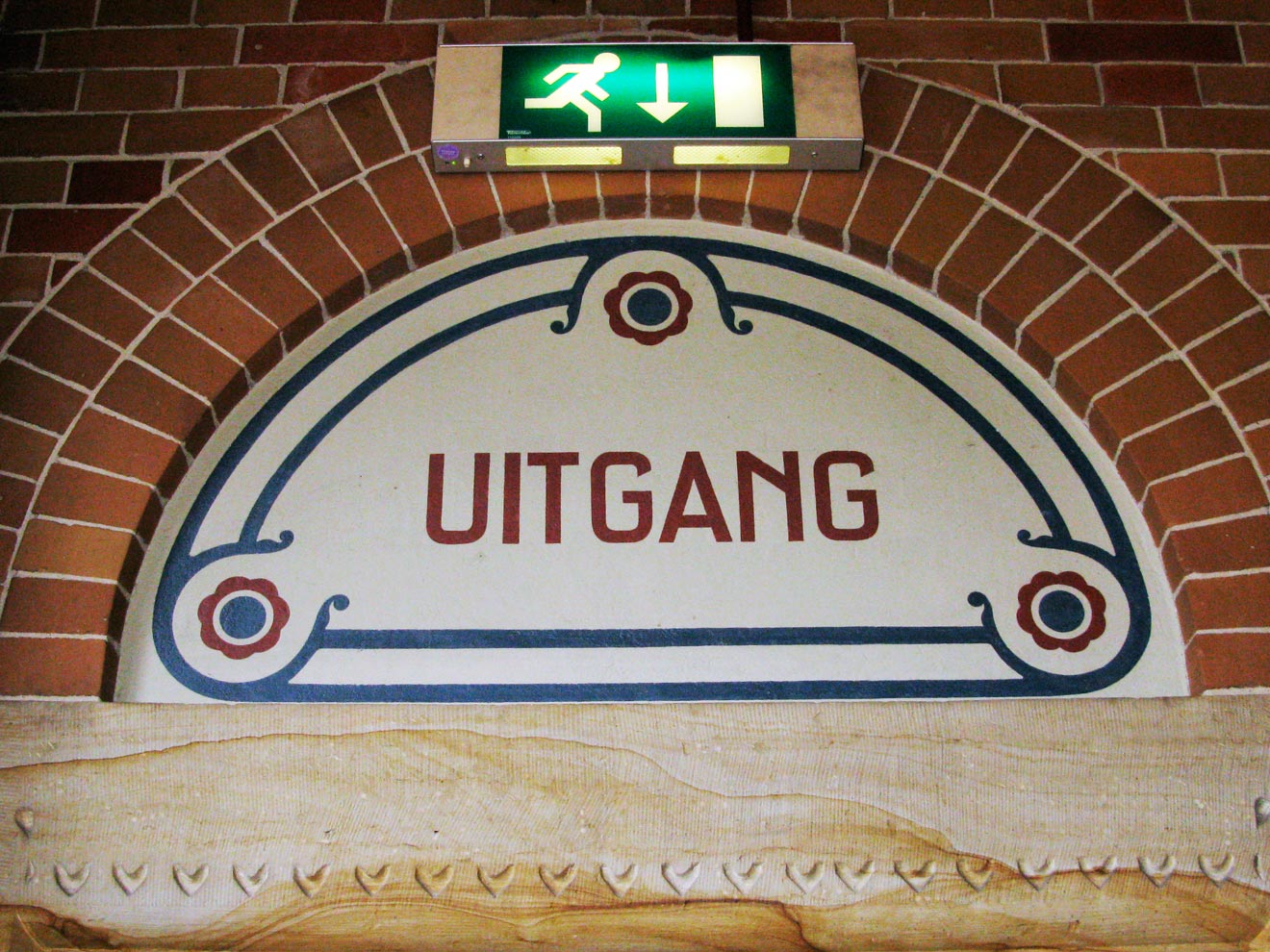 One example of the typical lettering above an exit in the Beurs van Berlage, showcasing Berlage’s signature style.